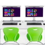 Flip top monitor desks for 2 people with 2 monitors up ready for use